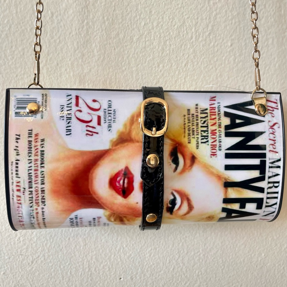 Fun Marilyn Monroe convertible “Vanity Fair” magazine purse on gold chain.